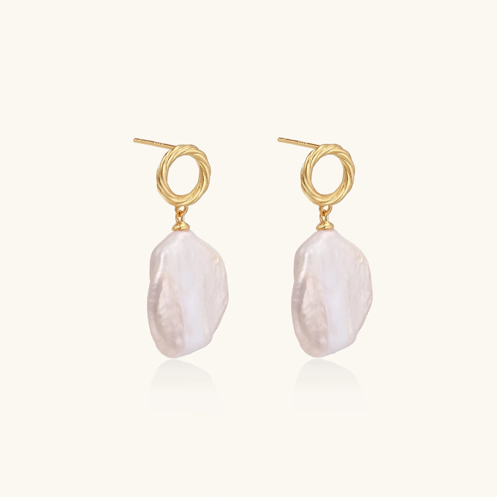 Side view of baroque pearl drop earrings with 18K gold vermeil twisted studs