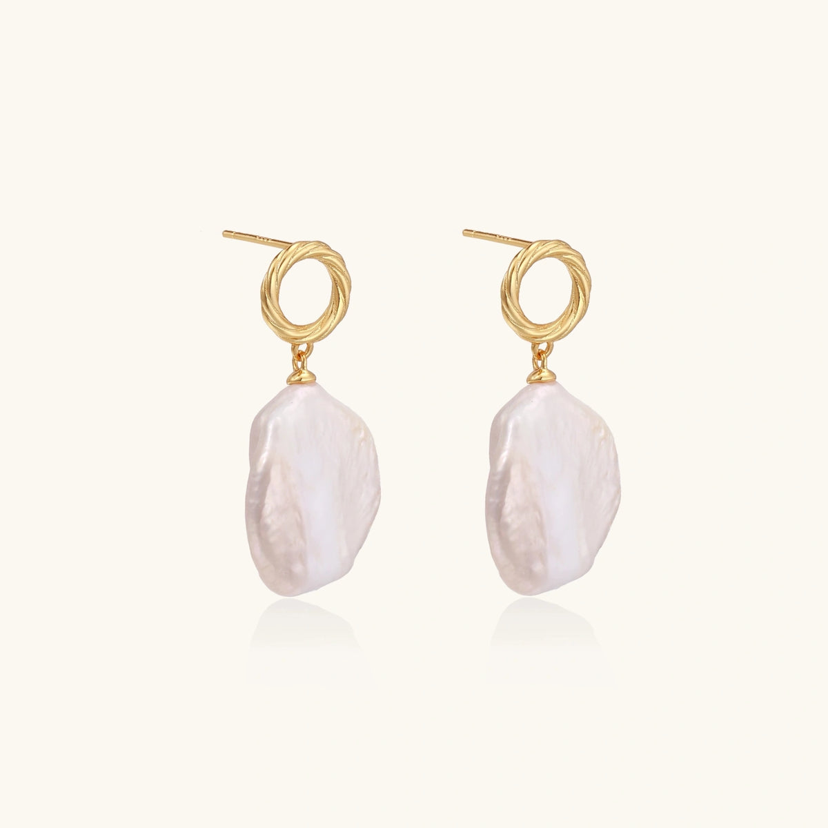 Side view of baroque pearl drop earrings with 18K gold vermeil twisted studs