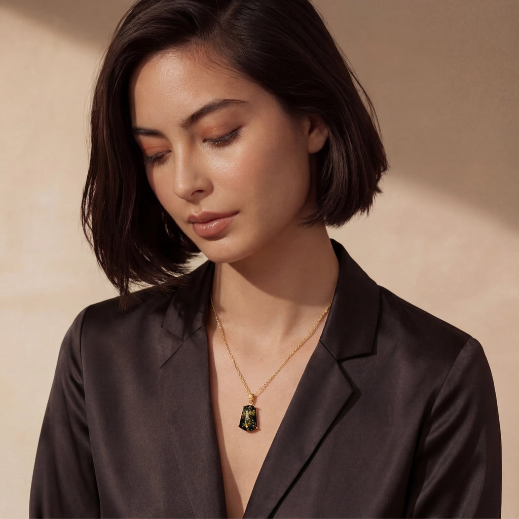 Forest Gold Amber Necklace styled with a tailored black blazer