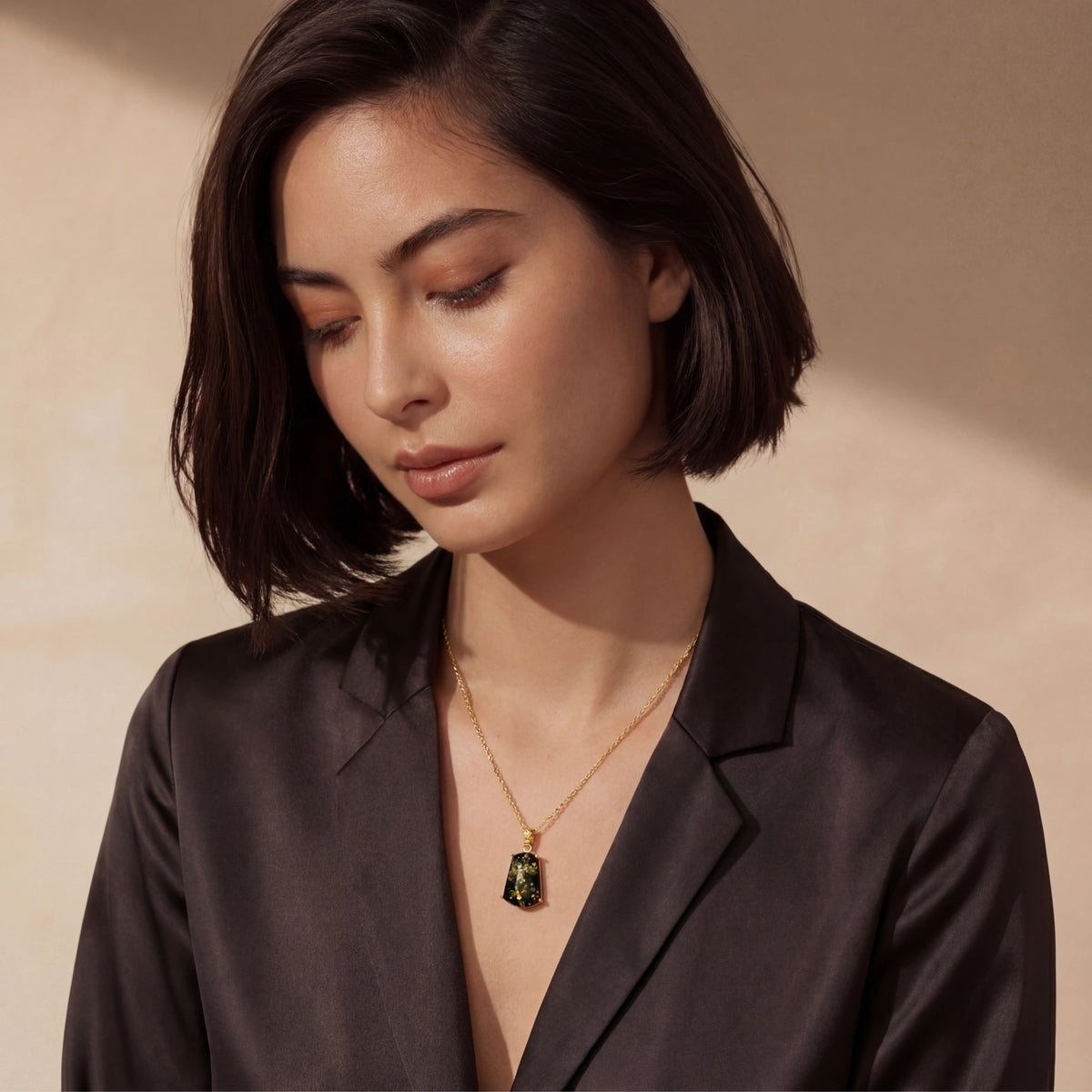Forest Gold Amber Necklace styled with a tailored black blazer