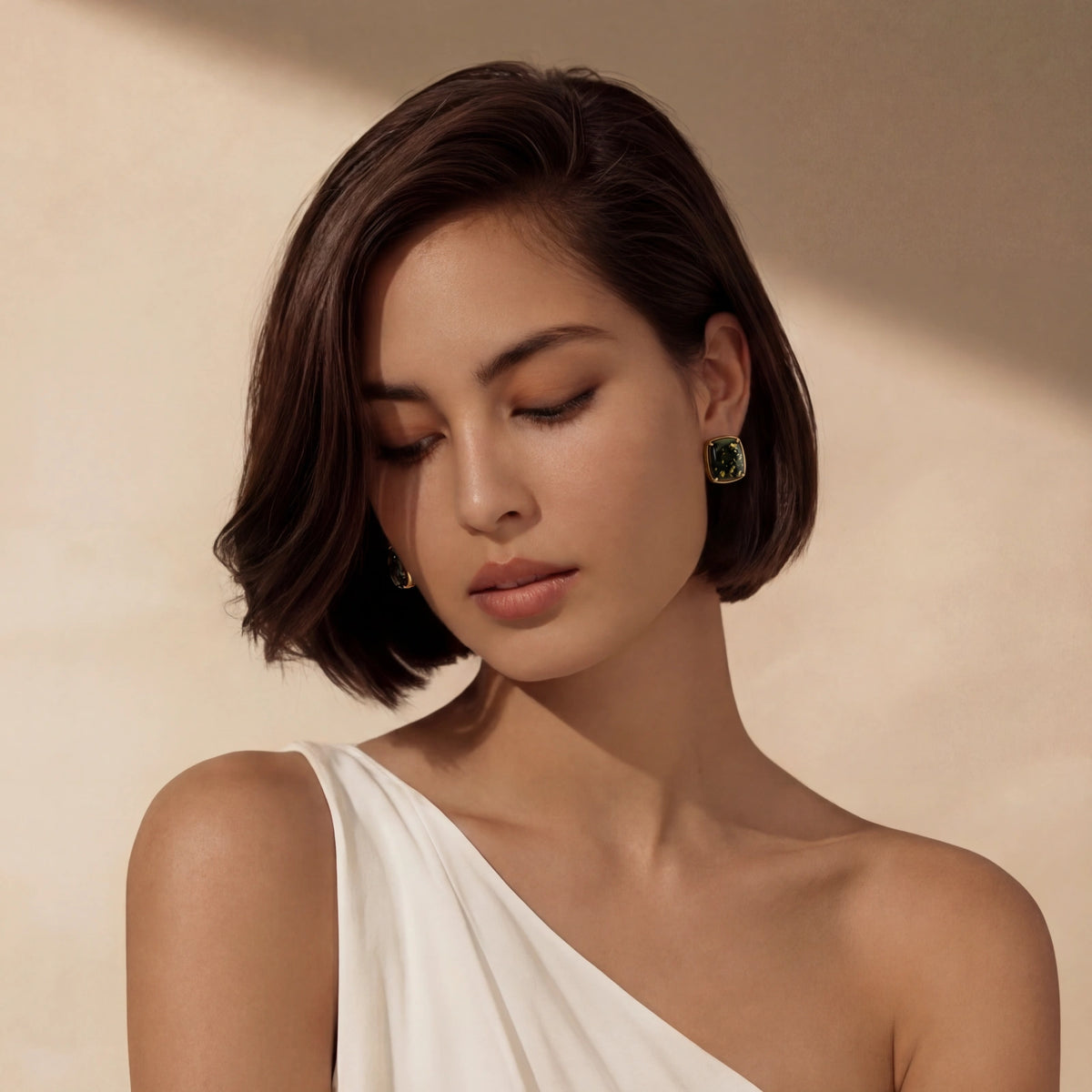 Model wearing Forest Reverie Earrings with green amber