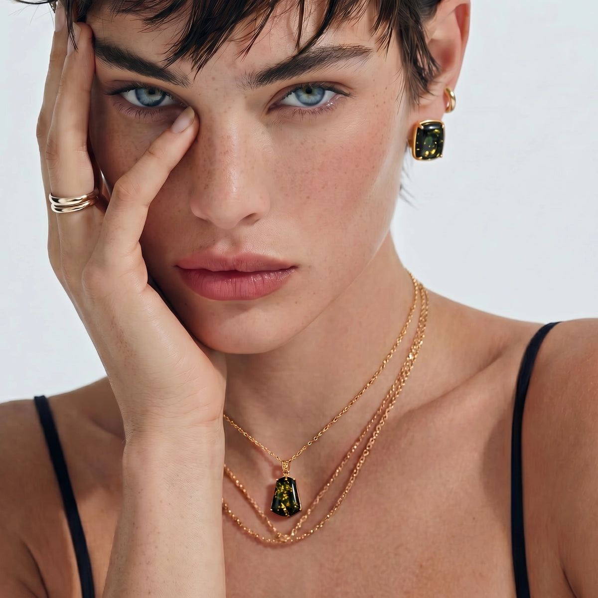 Model wearing Forest Gold Amber Necklace with green amber pendant